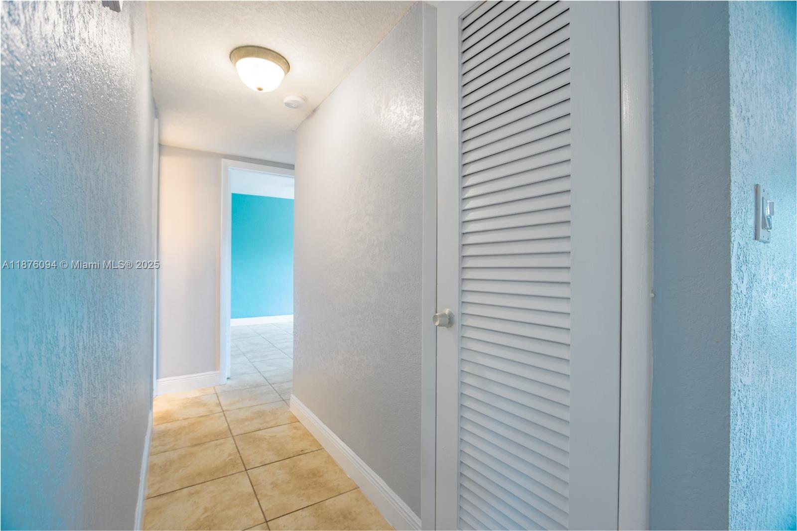 120 Royal Palm Road, Unit 315 Hialeah Gardens, FL 33016 - Photo 6 of 15 a view of a hallway