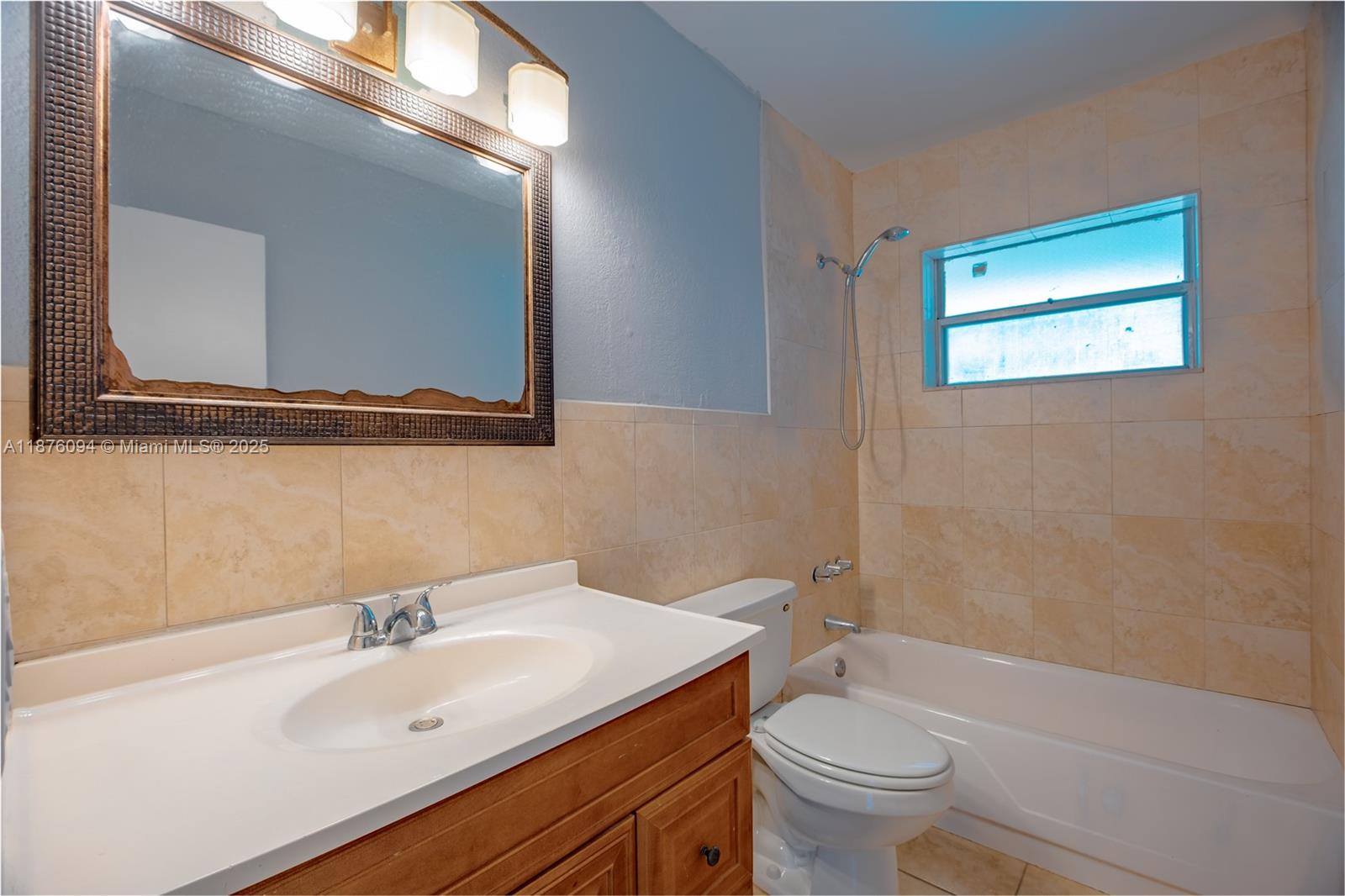 120 Royal Palm Road, Unit 315 Hialeah Gardens, FL 33016 - Photo 7 of 15 a bathroom with a sink mirror toilet and bathtub