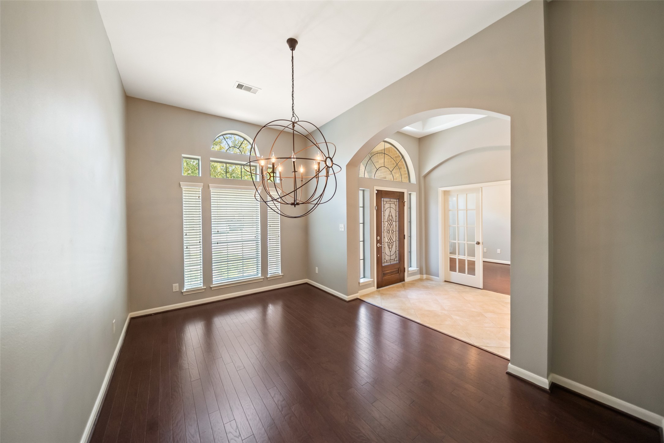 2818 Red Maple Drive Katy, TX 77494 - Photo 4 of 50 wooden floor in an empty room with a window
