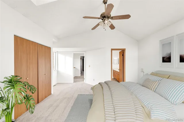 a bedroom with a balcony a bed and a chandelier