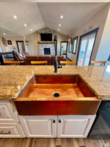 2101 Goose Ranch Road Vernal, UT 84078 - Photo 18 of 72 Farmhouse-style copper sink with a matte black faucet set into a granite countertop