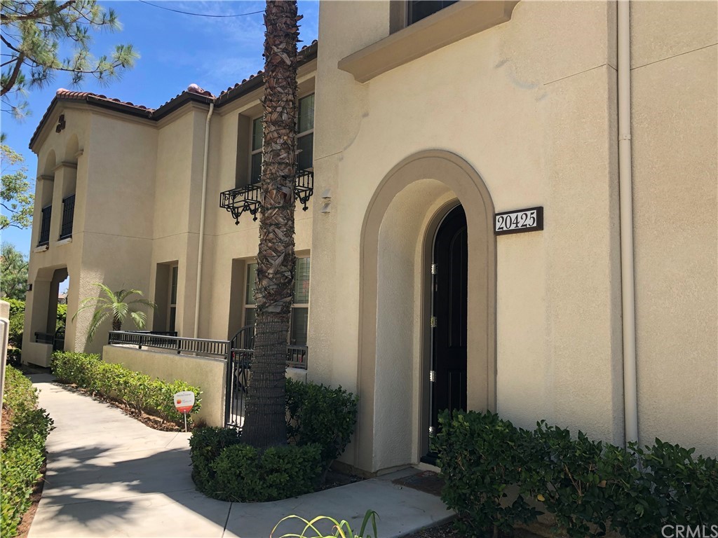 20425 Paseo Azul Porter Ranch, CA 91326 - Photo 1 of 1 a front view of a house with a garden