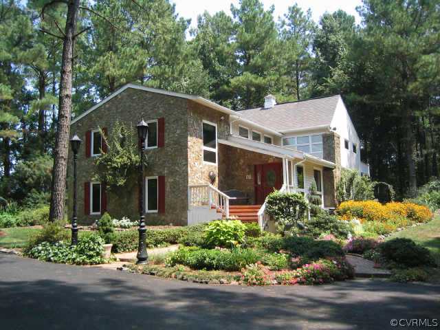 5015 Takach Road Prince George, VA 23875 - Photo 1 of 1 a front view of a house with a yard