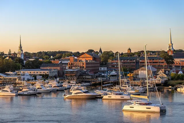a view of a lake with boats and trees