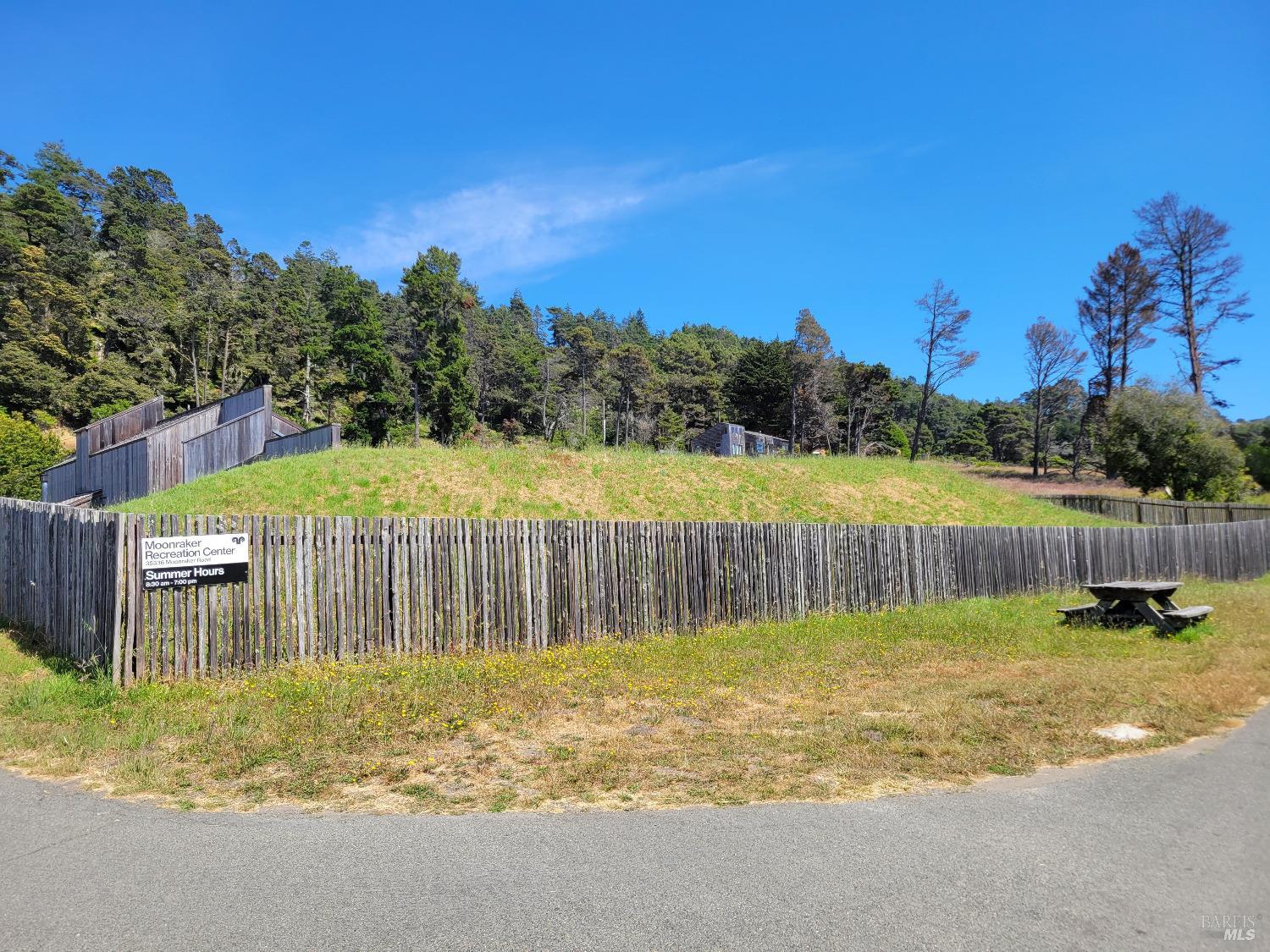 315 Chinquapin Lane The Sea Ranch, CA 95497 - Photo 11 of 18 a view of a backyard with a garden and deck