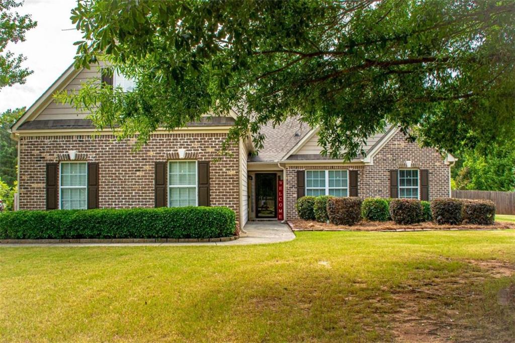 200 Poplar Ridge Drive Monroe, GA 30655 - Photo 1 of 1 a front view of house with yard and green space