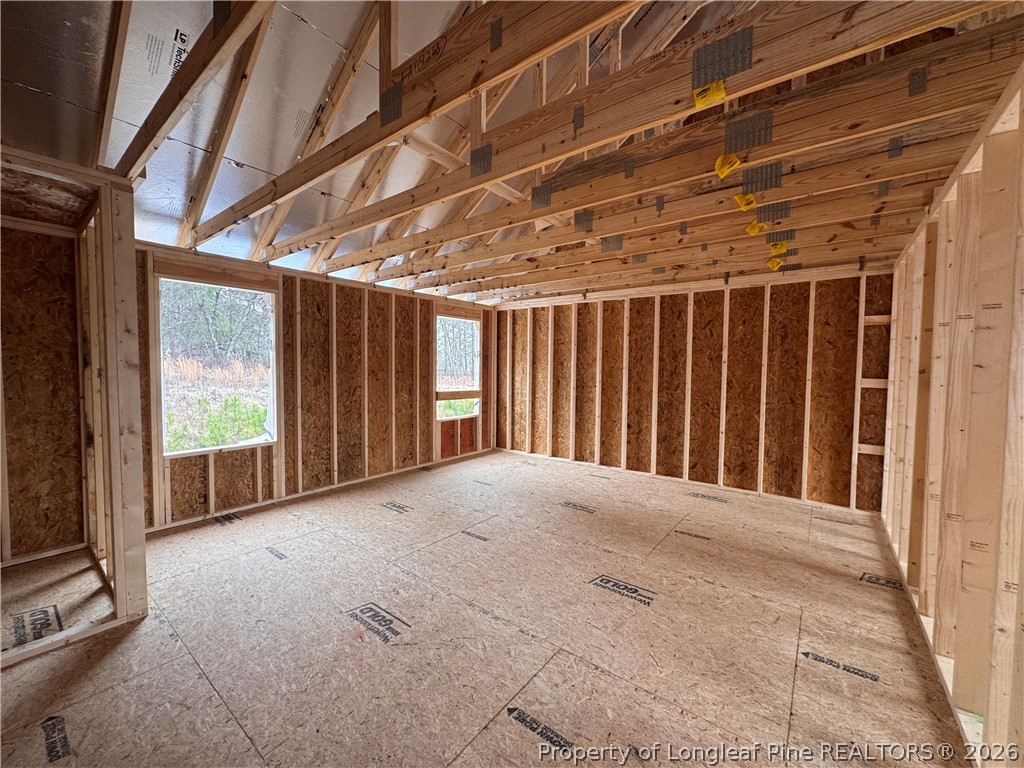 298 Rough Rdg Trail Aberdeen, NC 28315 - Photo 16 of 25 a view of an empty room with a balcony
