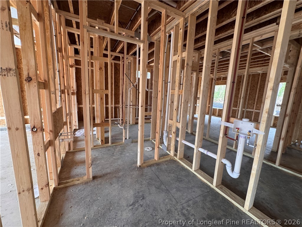 298 Rough Rdg Trail Aberdeen, NC 28315 - Photo 5 of 25 a view of an empty room with stairs