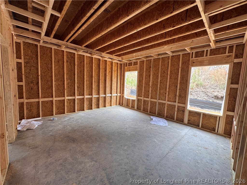 298 Rough Rdg Trail Aberdeen, NC 28315 - Photo 8 of 25 a view of an empty room with a window