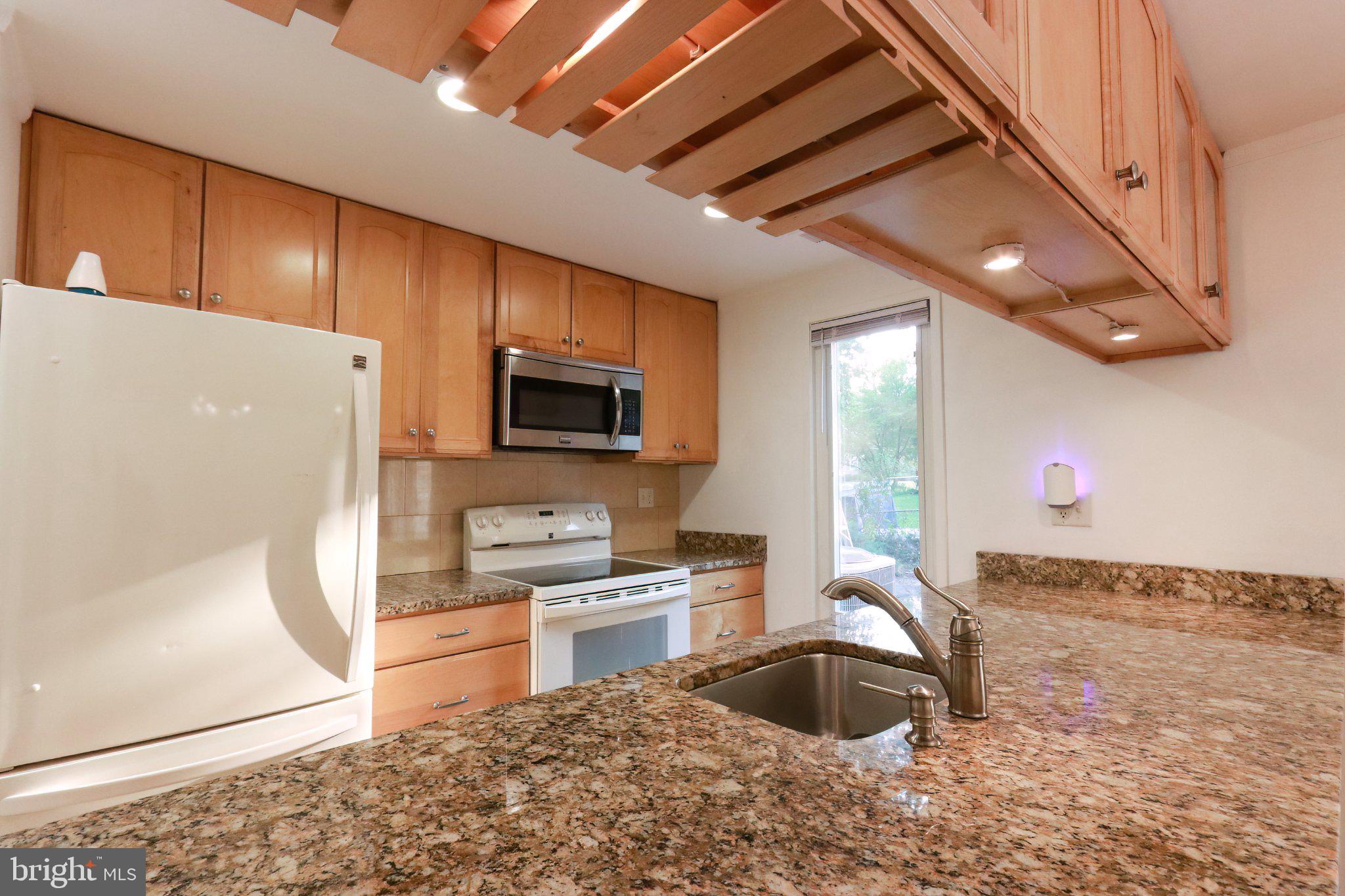 10704 Lester Street Silver Spring, MD 20902 - Photo 10 of 21 Modern kitchen with sleek finishes.
