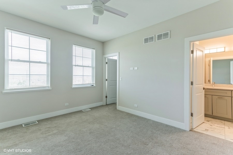10604 Alice Mae Court Orland Park, IL 60462 - Photo 8 of 14 a view of an empty room with window and cabinet