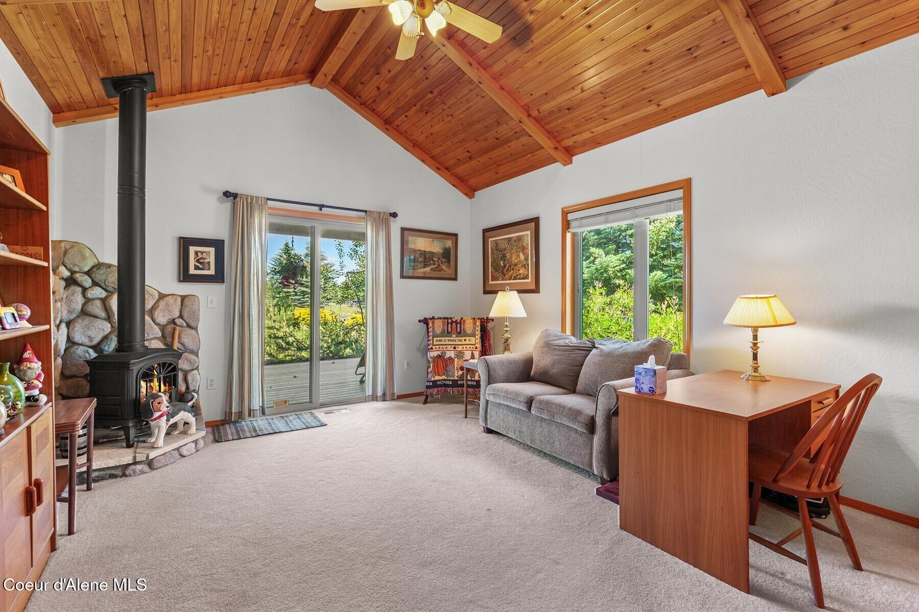 1655 West Diamond Bar Road Rathdrum, ID 83858 - Photo 21 of 55 Sunroom with Wood Stove