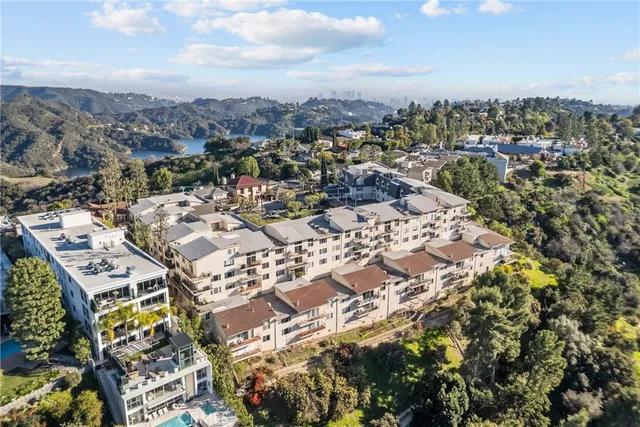 an aerial view of residential houses with outdoor space