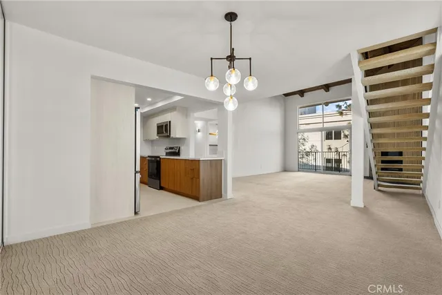 a view of a kitchen with a sink and dishwasher cabinets
