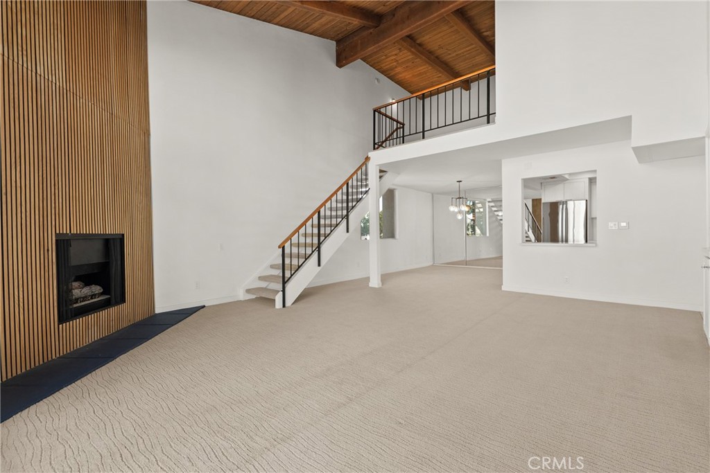 2385 Roscomare Road, Unit F16 Los Angeles, CA 90077 - Photo 17 of 39 a view of a livingroom with an empty space and a fireplace