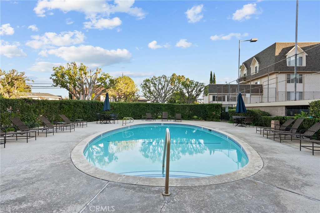 2385 Roscomare Road, Unit F16 Los Angeles, CA 90077 - Photo 32 of 39 a view of a swimming pool with a patio