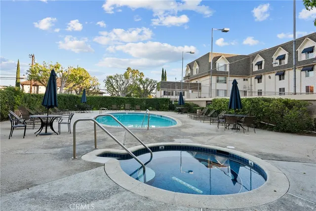 a view of a swimming pool with a lounge chairs
