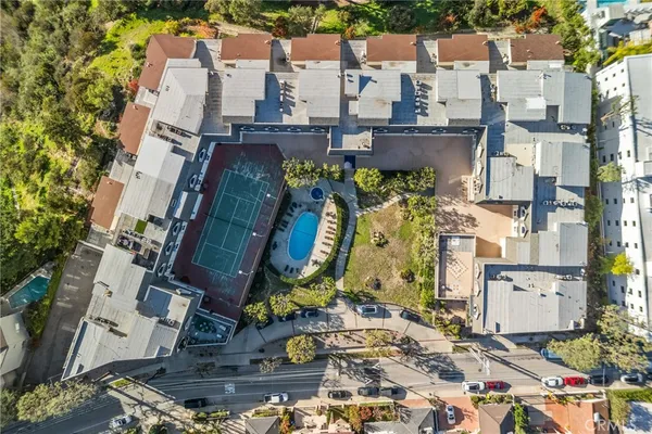 an aerial view of residential houses with outdoor space