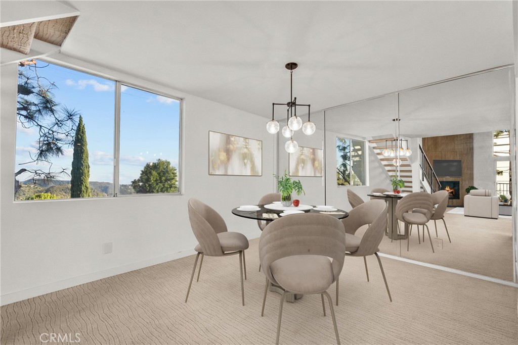 2385 Roscomare Road, Unit F16 Los Angeles, CA 90077 - Photo 5 of 40 a view of a dining room with furniture window and outside view
