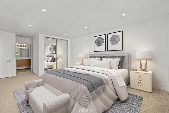 a spacious bedroom with a bed and a couch