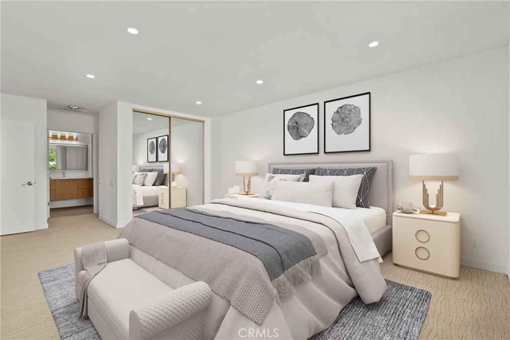 2385 Roscomare Road, Unit F16 Los Angeles, CA 90077 - Photo 8 of 40 a spacious bedroom with a bed and a couch