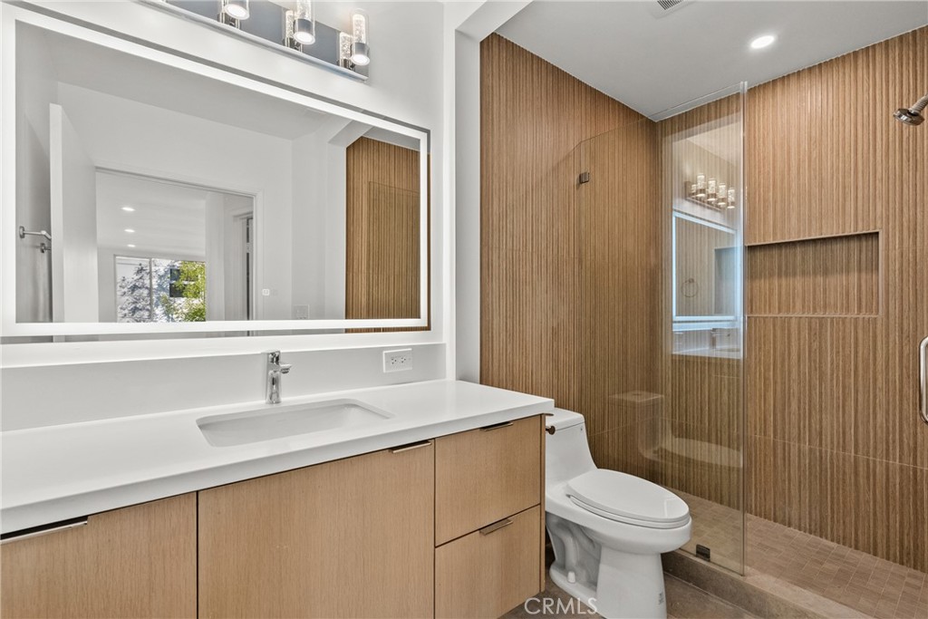 2385 Roscomare Road, Unit F16 Los Angeles, CA 90077 - Photo 9 of 39 a bathroom with a sink toilet and shower