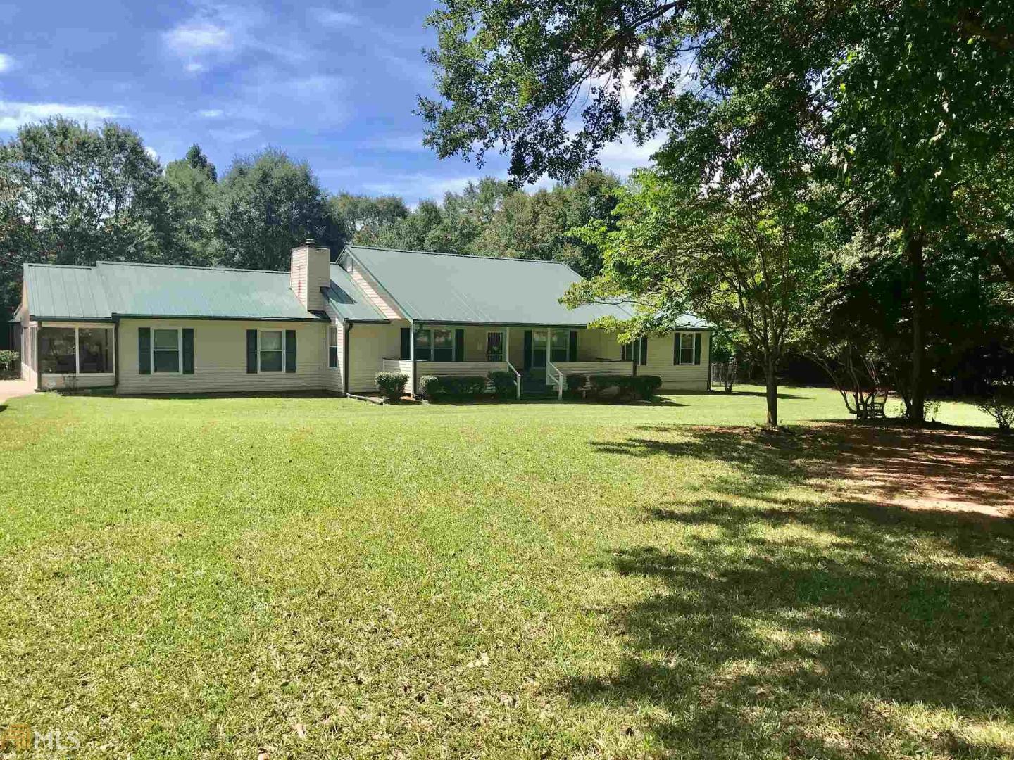 8315 Cleckler Road Palmetto, GA 30268 - Photo 1 of 1 a view of a house with a big yard