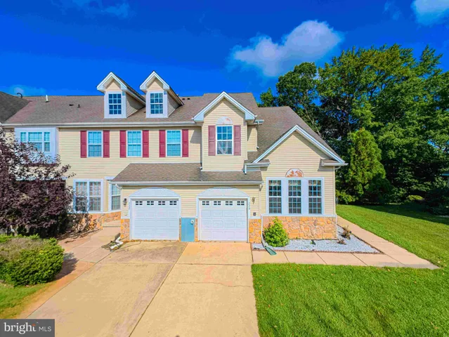 a front view of a house with yard