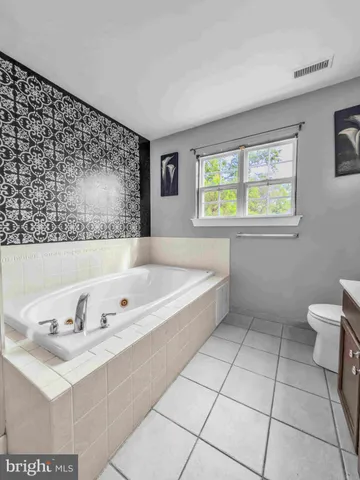 a bathroom with a bathtub and a sink