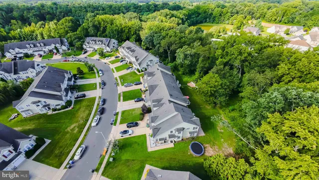 an aerial view of a house with a garden