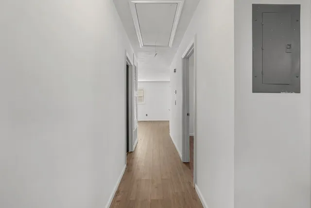 a kitchen with stainless steel appliances granite countertop a sink a stove and cabinets