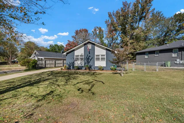 a view of backyard with green space