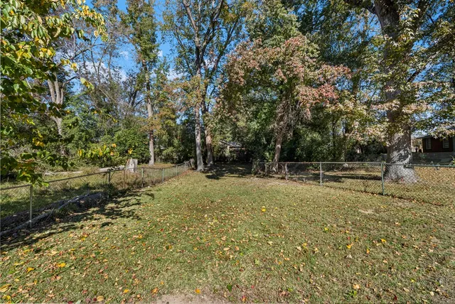 a backyard of a house with lots of green space