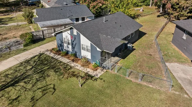 an aerial view of residential houses with outdoor space