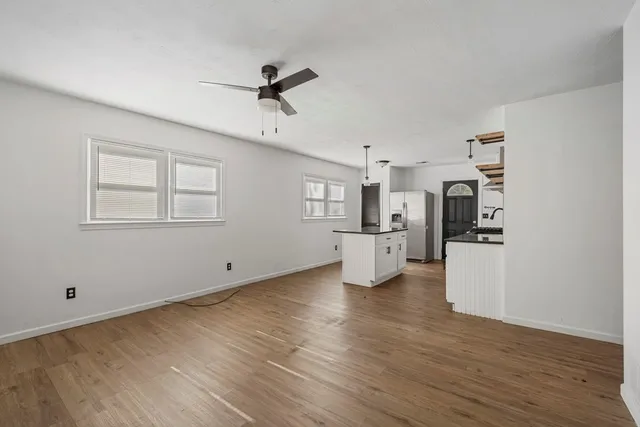 a view of a kitchen with microwave and cabinets