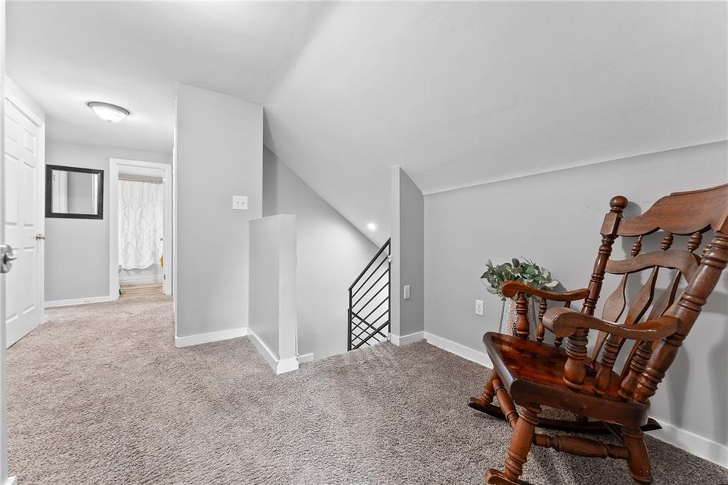 5670 Library Road Bethel Park, PA 15102 - Photo 22 of 49 The open hallway on the second floor is a surprising feature not typically found in a Cape Cod home, adding an unexpected sense of space and openness.