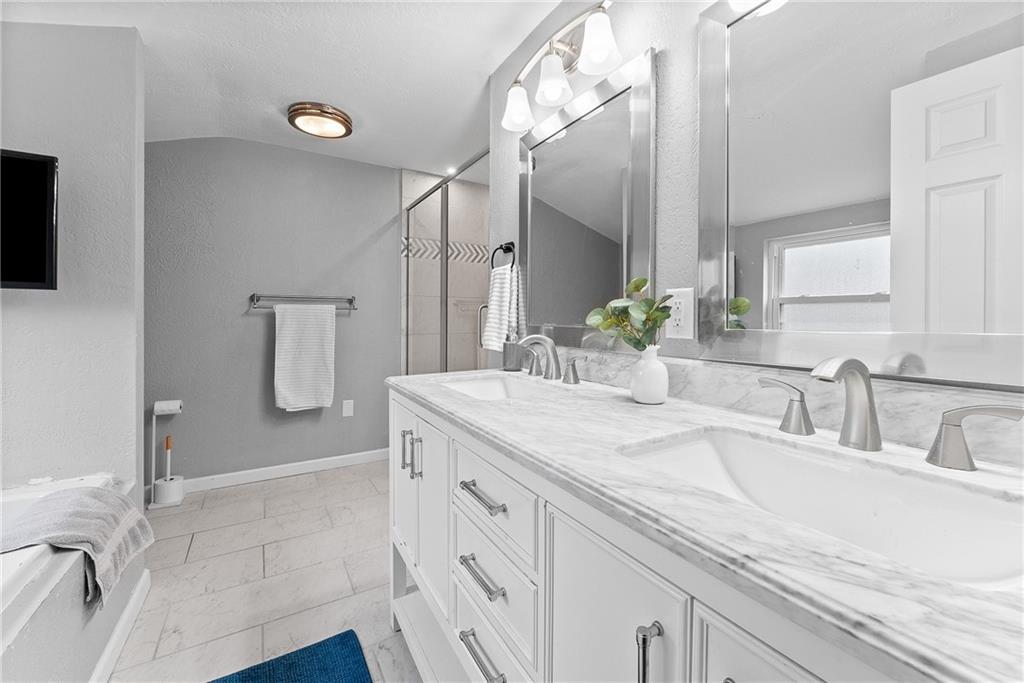 5670 Library Road Bethel Park, PA 15102 - Photo 27 of 49 Double marble top vanity sink, jetted soaking tub and ceramic shower