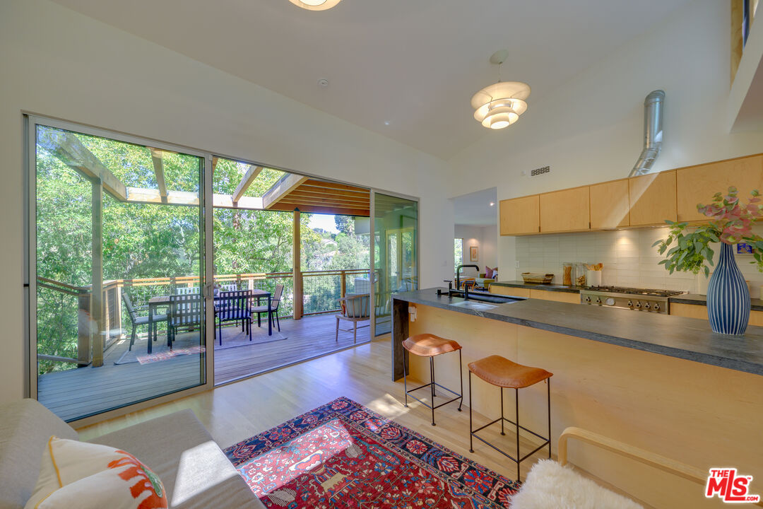 1847 Calgary Lane Los Angeles, CA 90077 - Photo 13 of 43 a living room with furniture and a large window