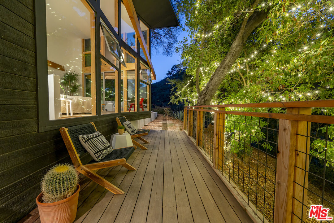1847 Calgary Lane Los Angeles, CA 90077 - Photo 20 of 43 a view of balcony with wooden floor and outdoor seating