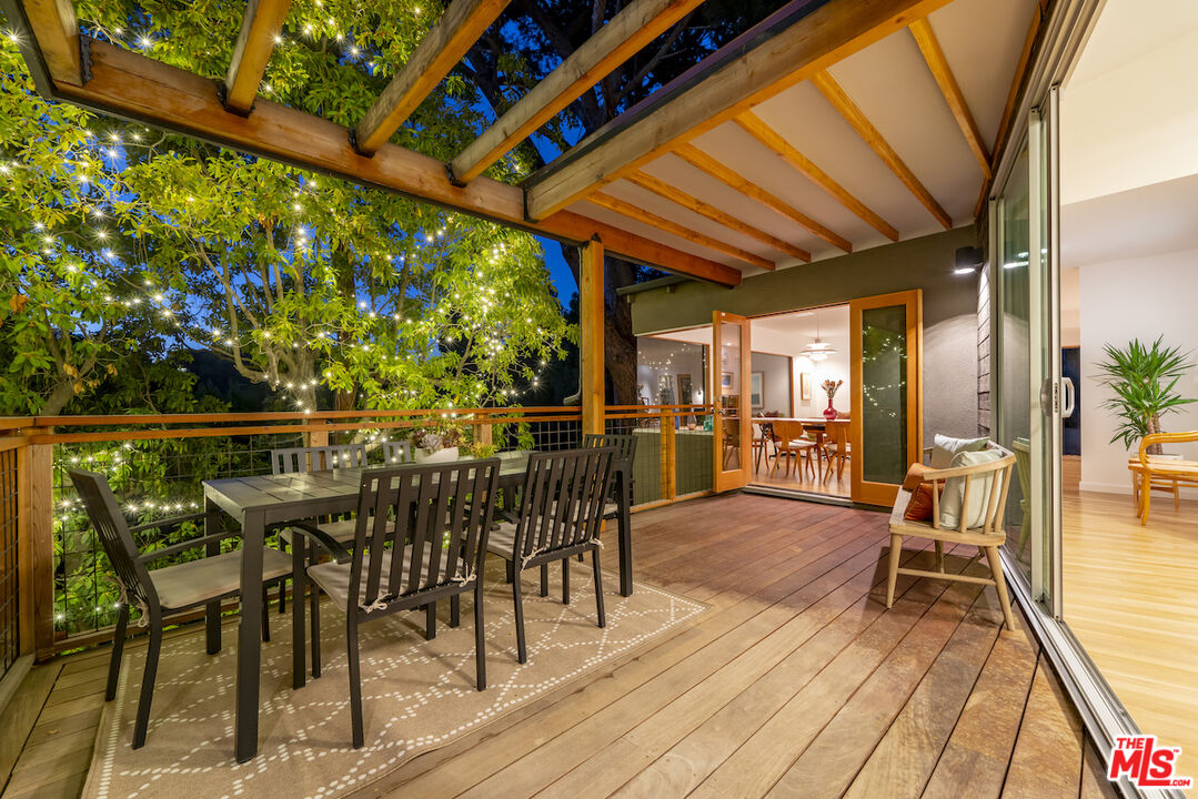 1847 Calgary Lane Los Angeles, CA 90077 - Photo 21 of 43 a view of a chairs and table on the wooden floor