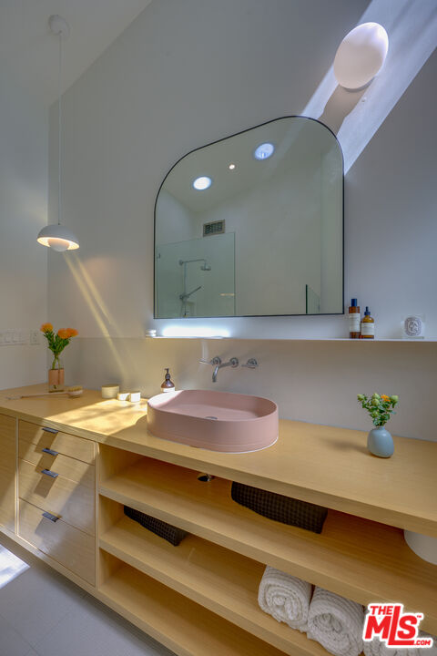 1847 Calgary Lane Los Angeles, CA 90077 - Photo 33 of 43 a bathroom with a sink and a mirror