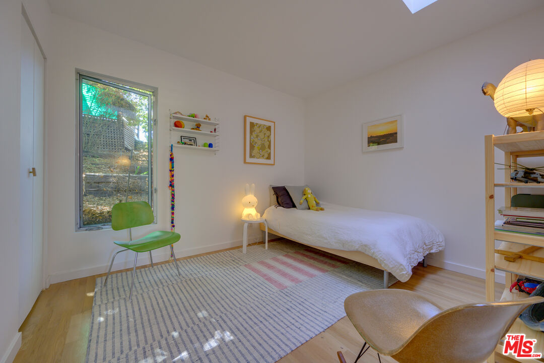 1847 Calgary Lane Los Angeles, CA 90077 - Photo 34 of 43 a bedroom with a bed and a window
