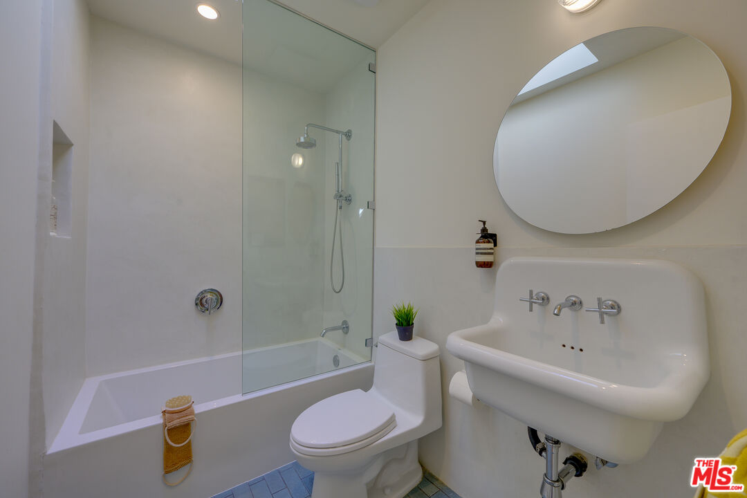 1847 Calgary Lane Los Angeles, CA 90077 - Photo 35 of 43 a bathroom with a sink a toilet and shower