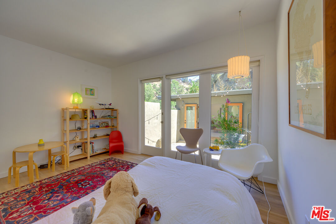 1847 Calgary Lane Los Angeles, CA 90077 - Photo 37 of 43 a bed room with a bed and a couch