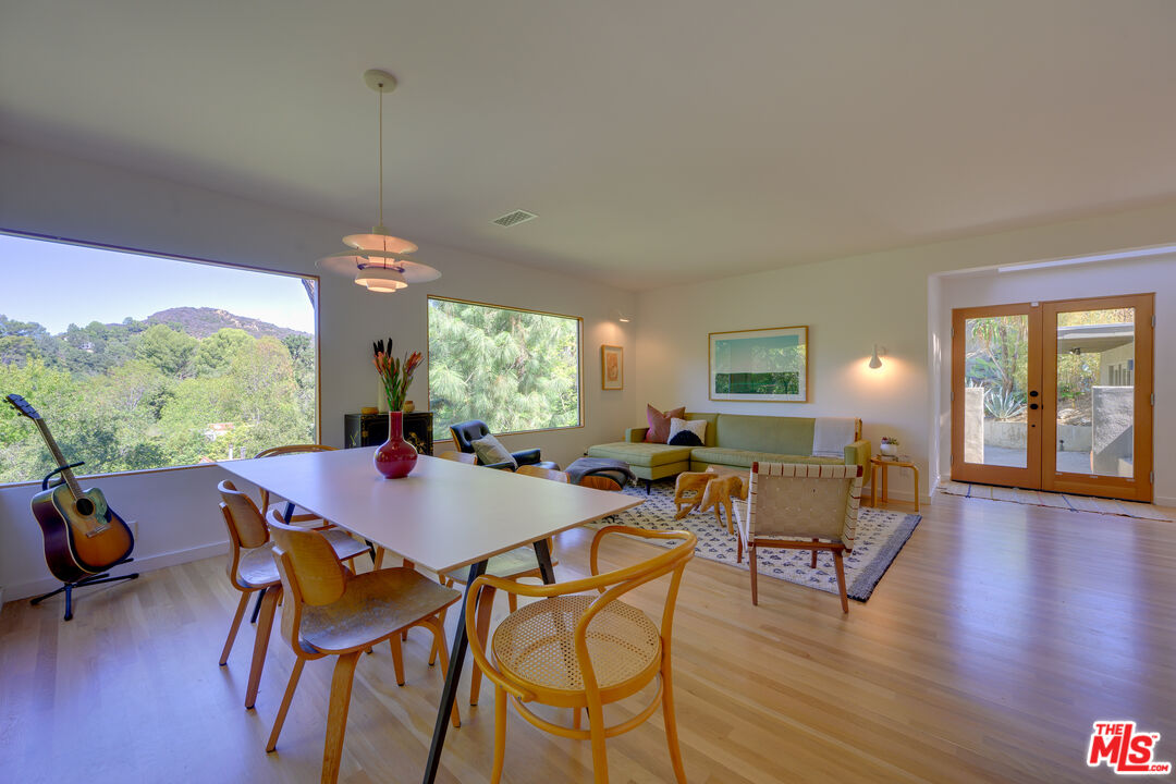 1847 Calgary Lane Los Angeles, CA 90077 - Photo 5 of 43 a view of a dining room with furniture window and wooden floor