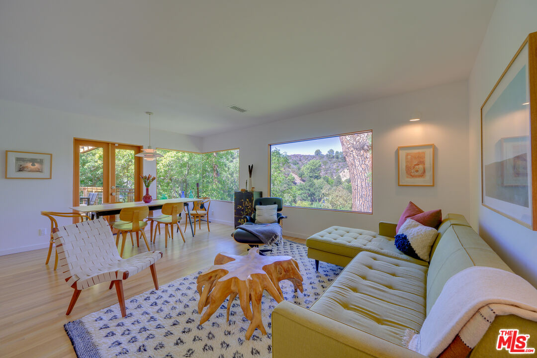 1847 Calgary Lane Los Angeles, CA 90077 - Photo 7 of 43 a living room with furniture and a large window
