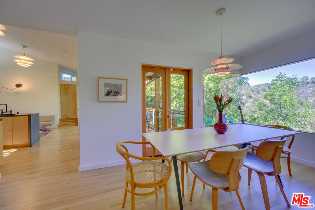 1847 Calgary Lane Los Angeles, CA 90077 - Photo 9 of 43 a view of a dining room with furniture window and wooden floor