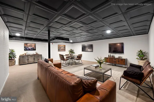a reading room with furniture and a book shelf