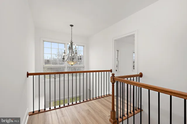 a bathroom with a granite countertop bathtub sink vanity and mirror