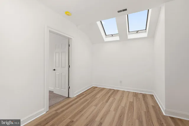 a view of a wooden deck with a yard